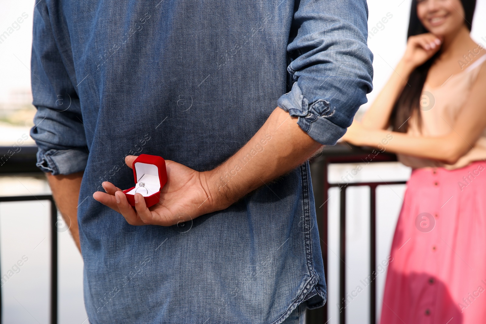 Man with engagement ring making proposal to his girlfriend outdoors, closeup Photo of Man with engagement ring making proposal to his girlfriend outdoors, closeup