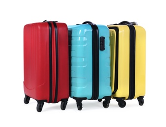 Stylish suitcases packed for travel on white background. Summer vacation Photo of Stylish suitcases packed for travel on white background. Summer vacation