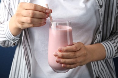 Woman with glass of tasty smoothie, closeup Image of Woman with glass of tasty smoothie, closeup