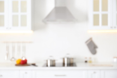 Blurred view of modern kitchen interior with white furniture Photo of Blurred view of modern kitchen interior with white furniture
