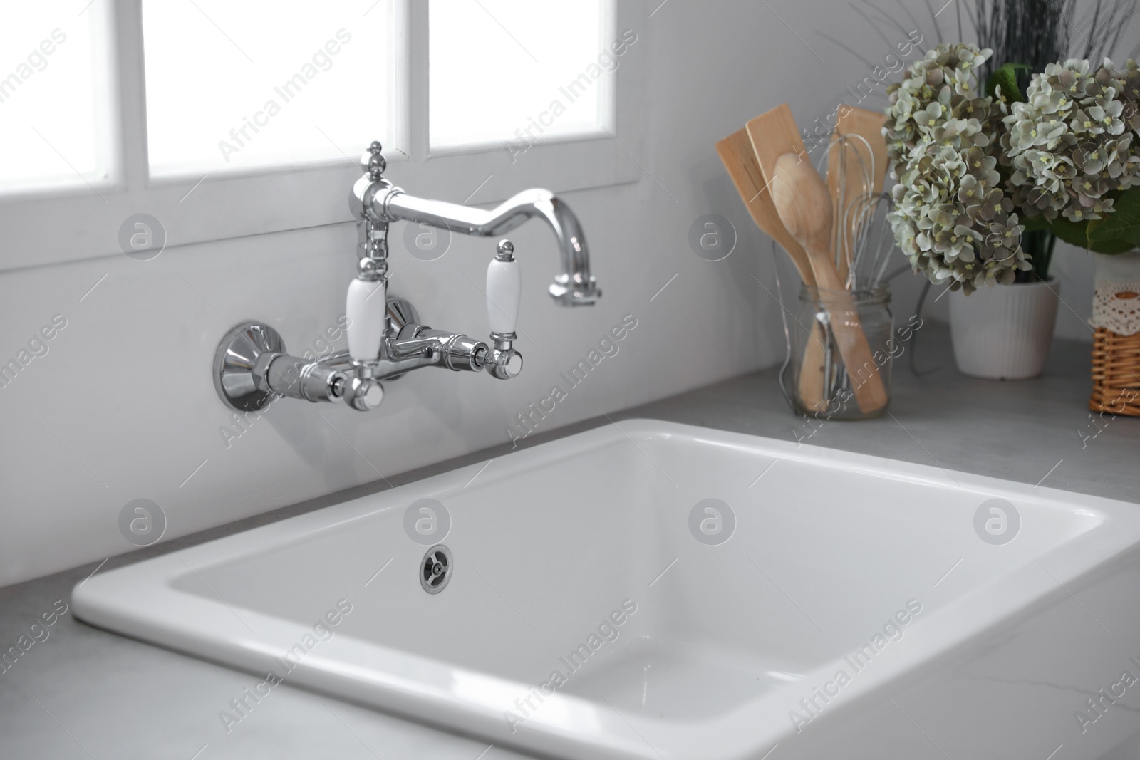 Kitchen counter with new ceramic sink and tap Photo of Kitchen counter with new ceramic sink and tap