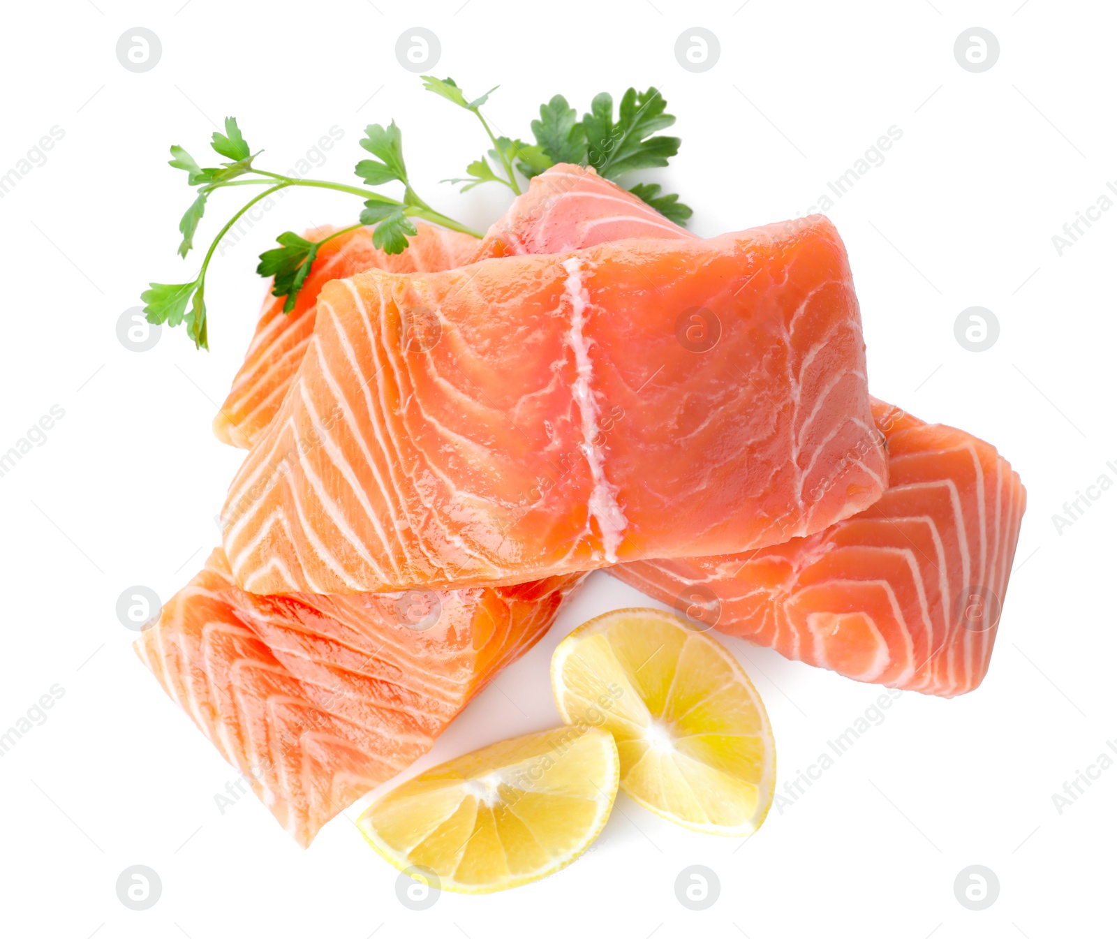 Fresh raw salmon with parsley and lemon on white background, top view. Fish delicacy Photo of Fresh raw salmon with parsley and lemon on white background, top view. Fish delicacy