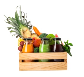 Bottles with delicious colorful juices and fresh ingredients in wooden crate on white background Photo of Bottles with delicious colorful juices and fresh ingredients in wooden crate on white background