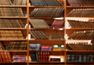 Blurred view of books on shelves in library Photo of Blurred view of books on shelves in library