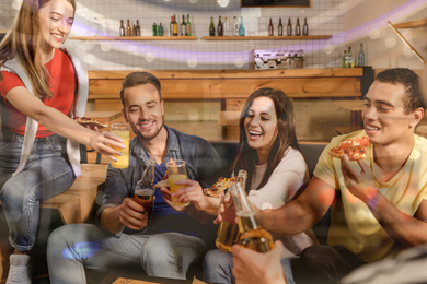 Group of friends having fun party with delicious pizza in cafe, bokeh effect Image of Group of friends having fun party with delicious pizza in cafe, bokeh effect