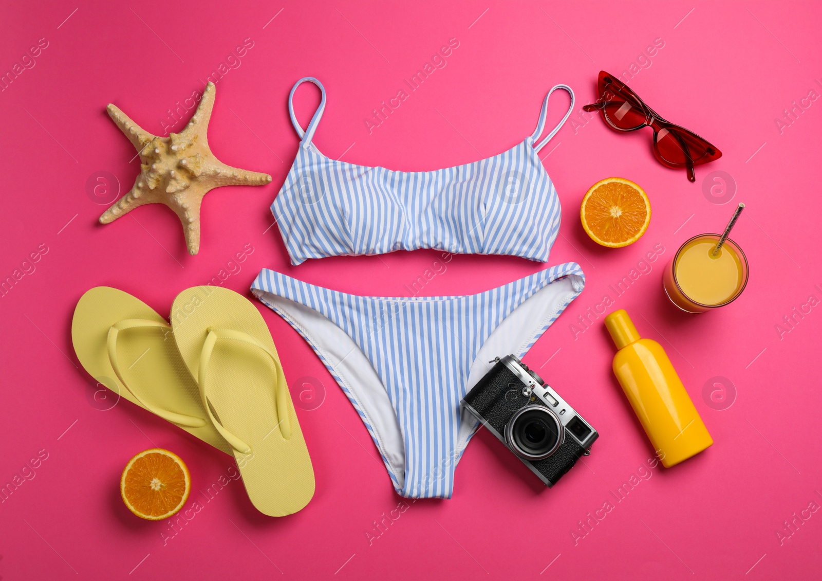 Flat lay composition with beach objects on pink background Photo of Flat lay composition with beach objects on pink background