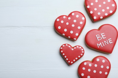 Delicious heart shaped cookies on white wooden table, flat lay with space for text. Valentine's Day Photo of Delicious heart shaped cookies on white wooden table, flat lay with space for text. Valentine's Day