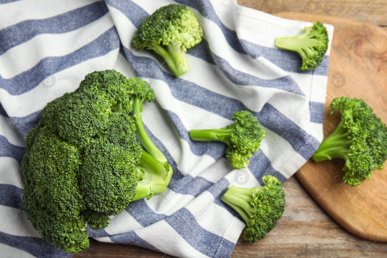 Fresh green broccoli on wooden table, above view. Organic food Photo of Fresh green broccoli on wooden table, above view. Organic food