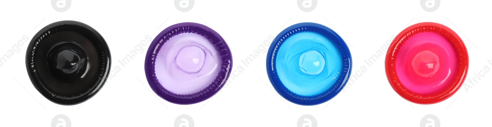 Set with different unpacked condoms on white background, top view. Banner design Image of Set with different unpacked condoms on white background, top view. Banner design