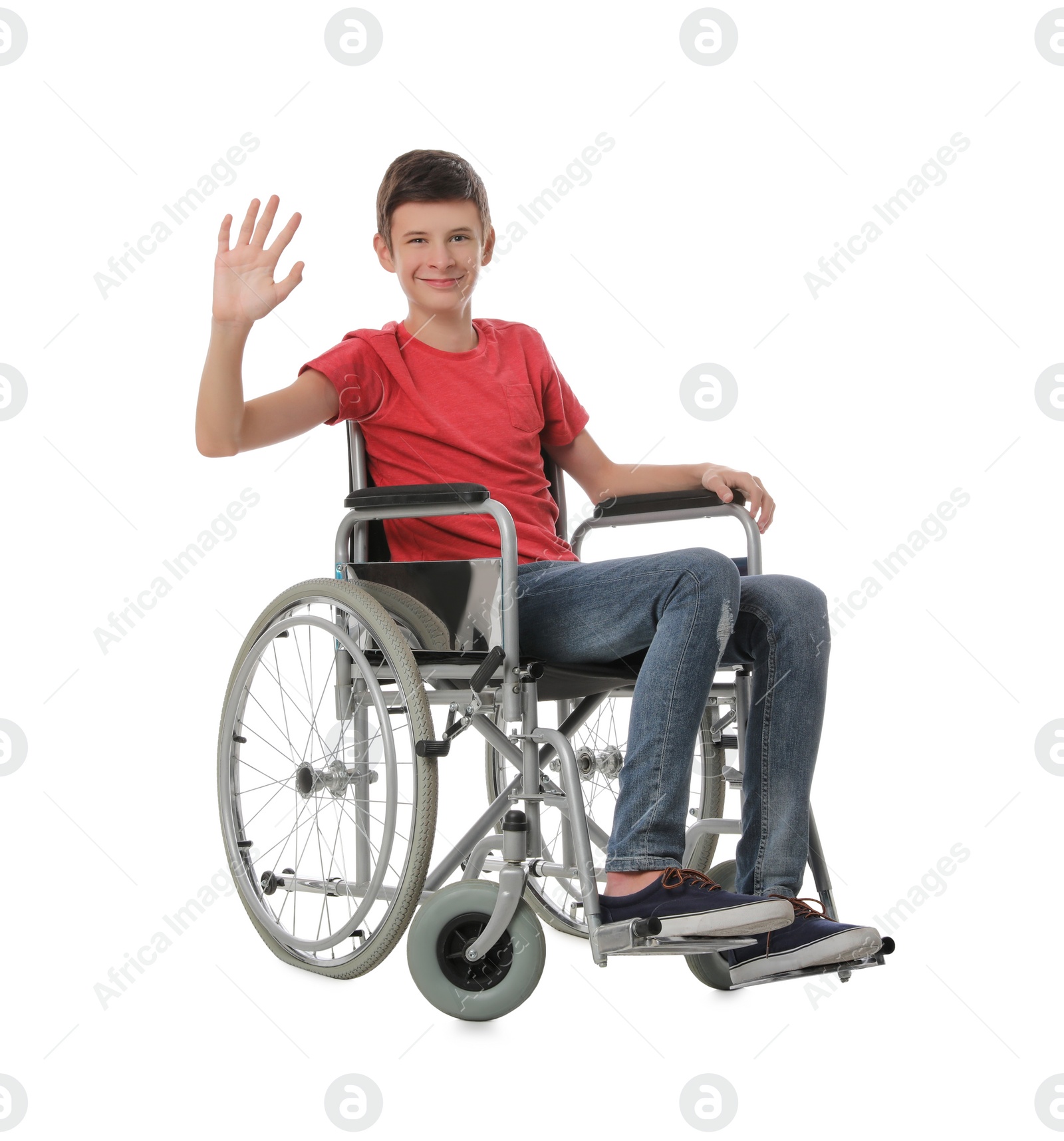 Teen boy in wheelchair on white background Photo of Teen boy in wheelchair on white background