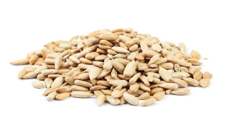Pile of peeled sunflower seeds isolated on white Photo of Pile of peeled sunflower seeds isolated on white