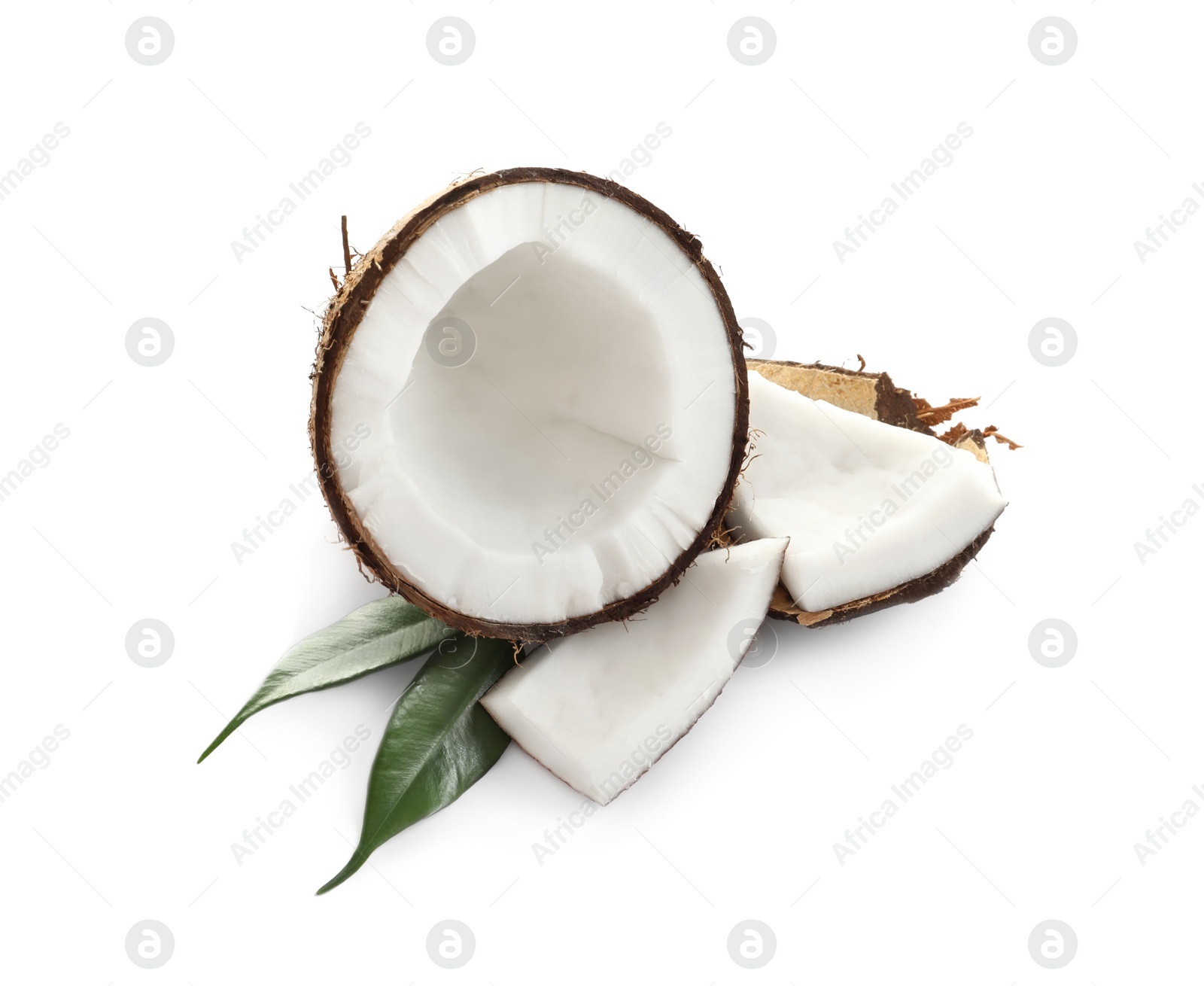 Ripe coconut with leaves on white background Photo of Ripe coconut with leaves on white background