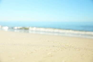 Beautiful sandy beach and sea under blue sky, closeup Photo of Beautiful sandy beach and sea under blue sky, closeup