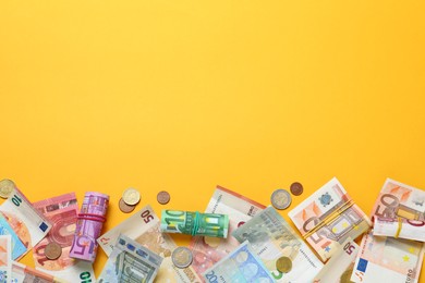 Money on yellow background, flat lay. Space for text Image of Money on yellow background, flat lay. Space for text