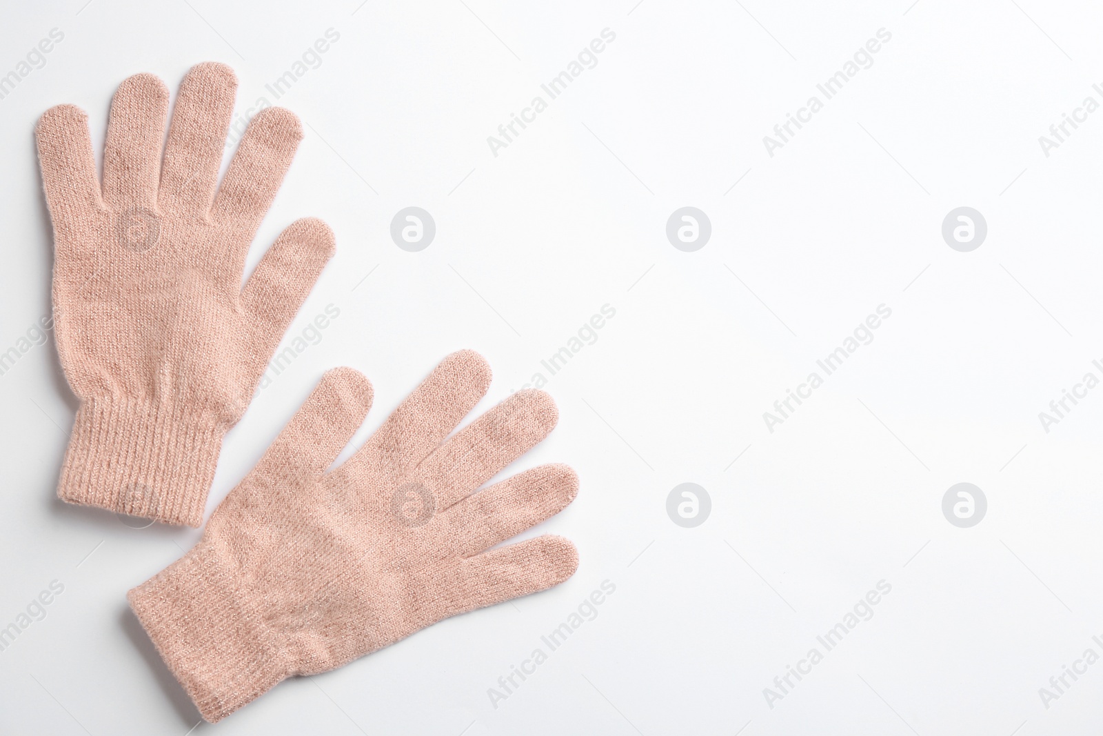 Pair of stylish woolen gloves on white background, flat lay. Space for text Photo of Pair of stylish woolen gloves on white background, flat lay. Space for text