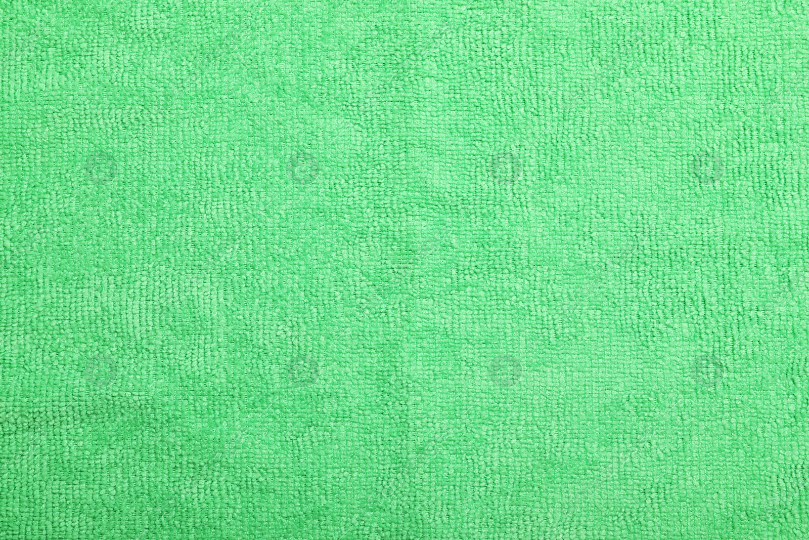 Light green microfiber cloth as background, top view Photo of Light green microfiber cloth as background, top view