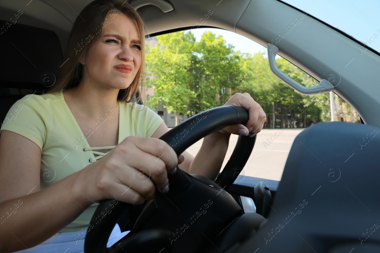 Emotional woman in car. Aggressive driving behavior Photo of Emotional woman in car. Aggressive driving behavior