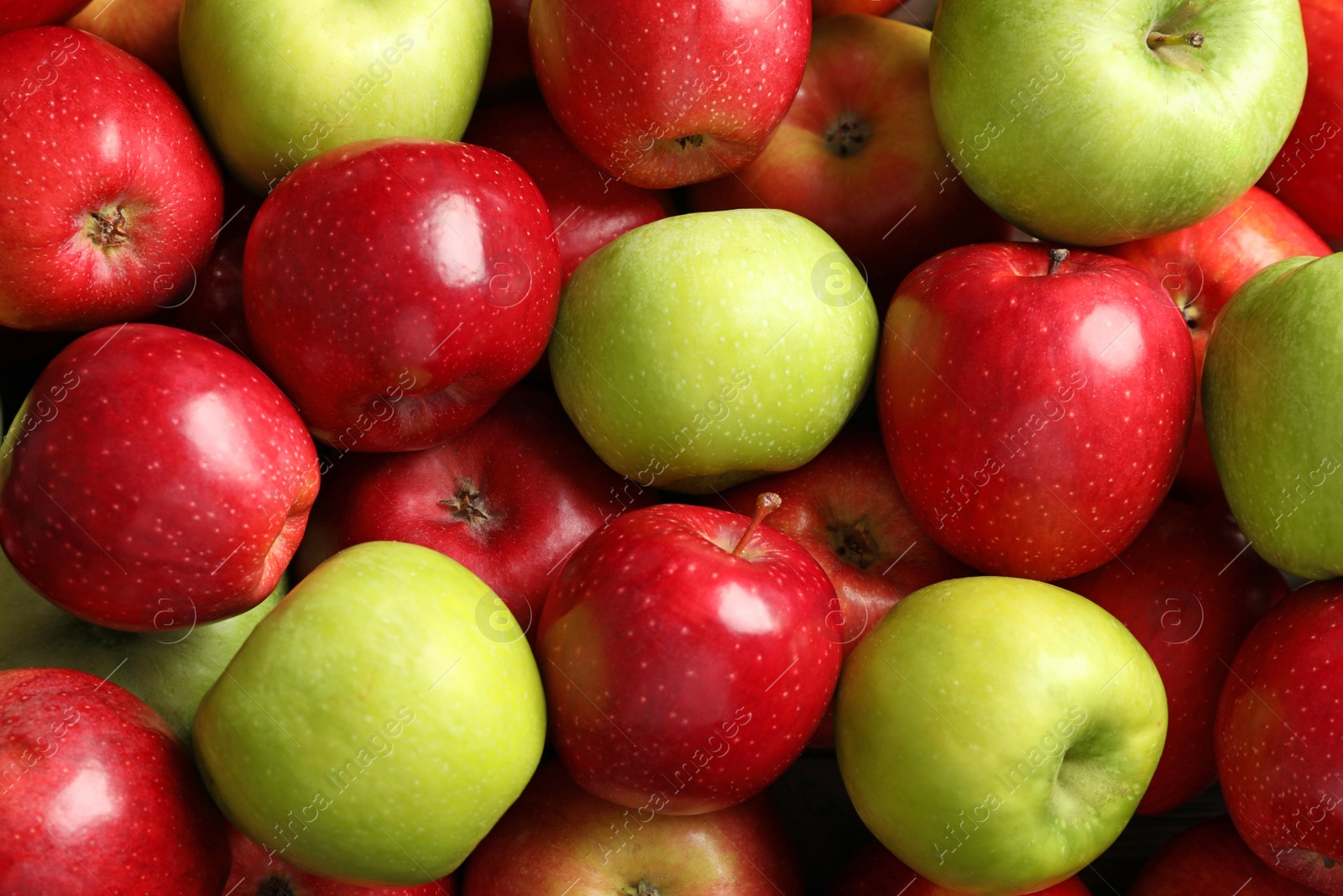 Fresh red and green apples as background Photo of Fresh red and green apples as background