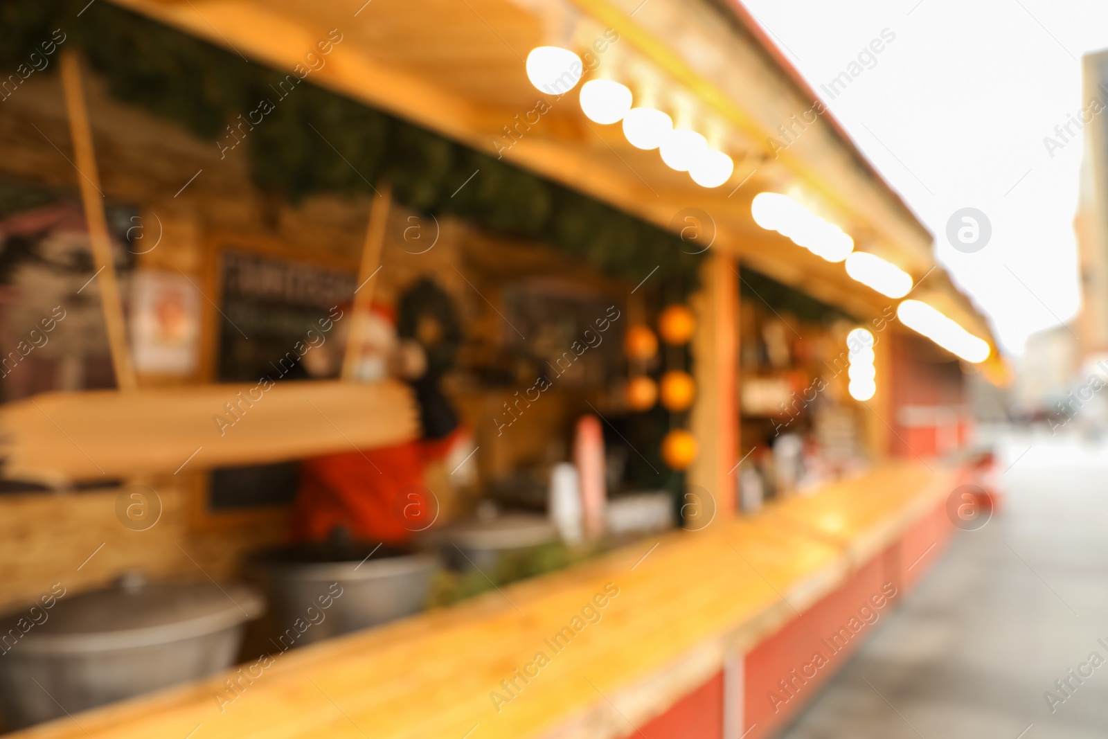 Blurred view of Christmas fair stall outdoors Photo of Blurred view of Christmas fair stall outdoors