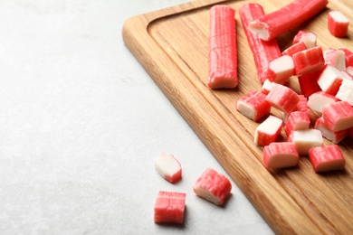 Cut crab sticks on light table, closeup. Space for text Photo of Cut crab sticks on light table, closeup. Space for text