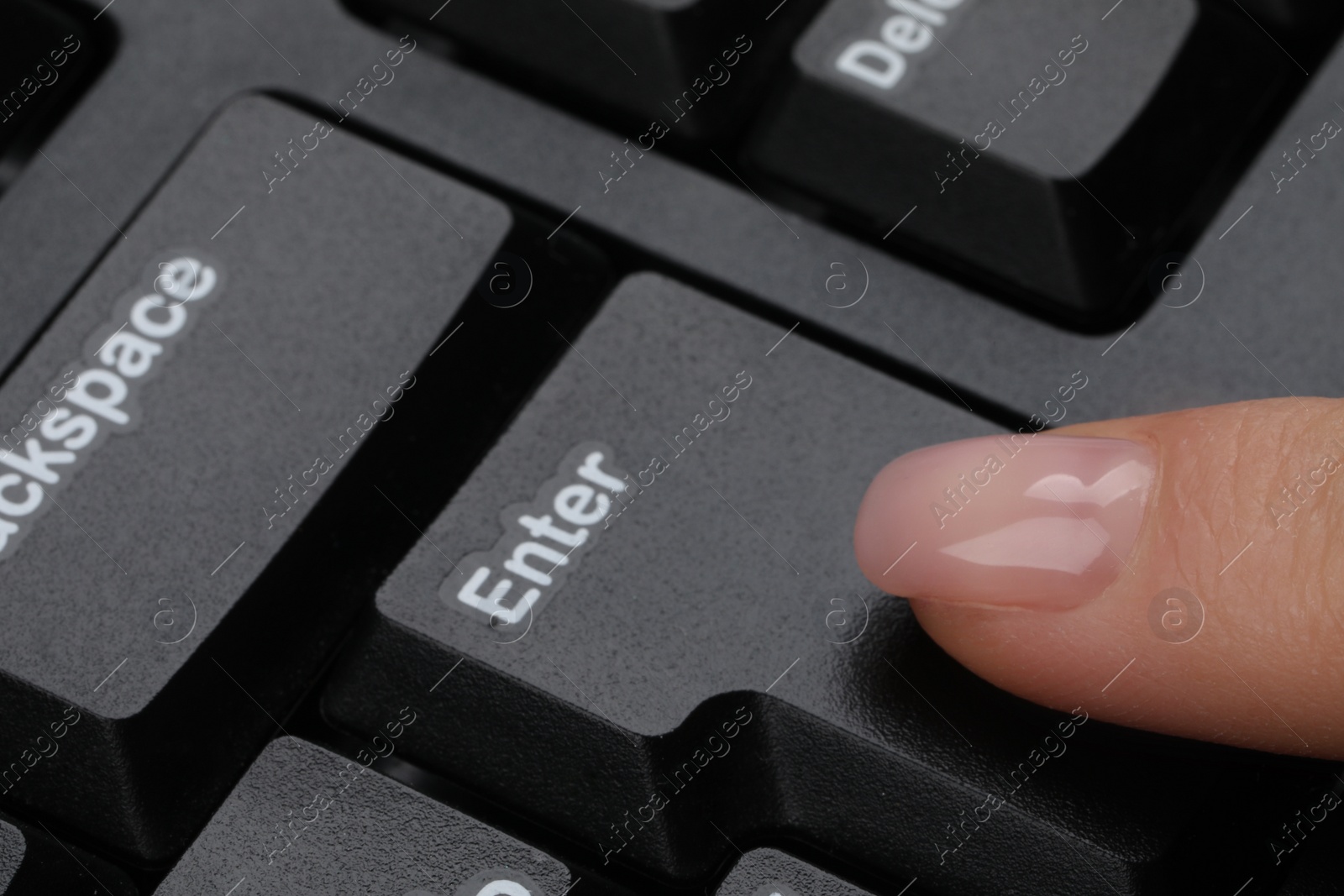 Woman pressing button on computer keyboard, closeup Photo of Woman pressing button on computer keyboard, closeup