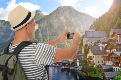 Tourist with travel backpack taking photo during vacation trip Image of Tourist with travel backpack taking photo during vacation trip