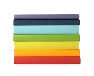 Many colorful hardcover books on white background Photo of Many colorful hardcover books on white background