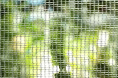 Insect screen for window against blurred background, closeup Photo of Insect screen for window against blurred background, closeup
