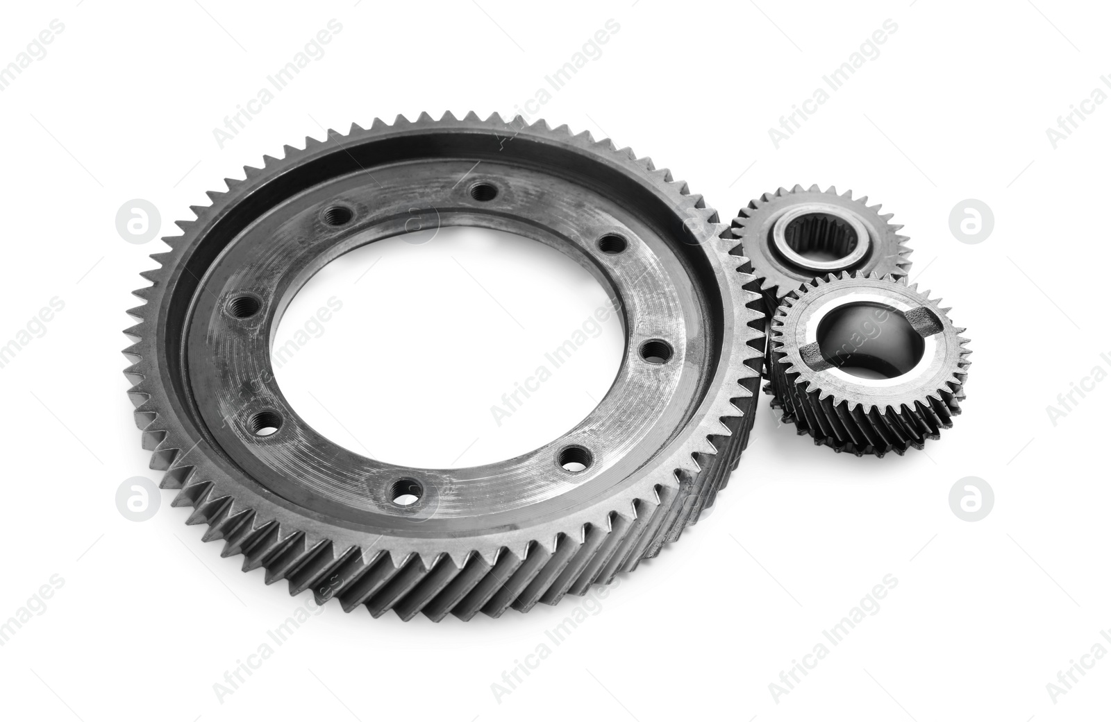 Different stainless steel gears on white background Photo of Different stainless steel gears on white background