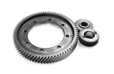 Different stainless steel gears on white background Photo of Different stainless steel gears on white background