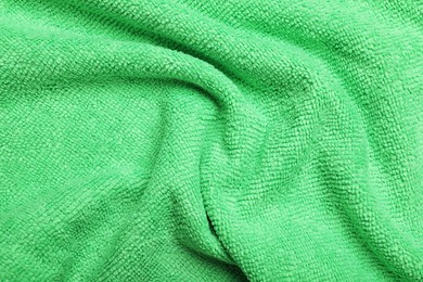 Crumpled light green microfiber cloth as background, closeup Photo of Crumpled light green microfiber cloth as background, closeup