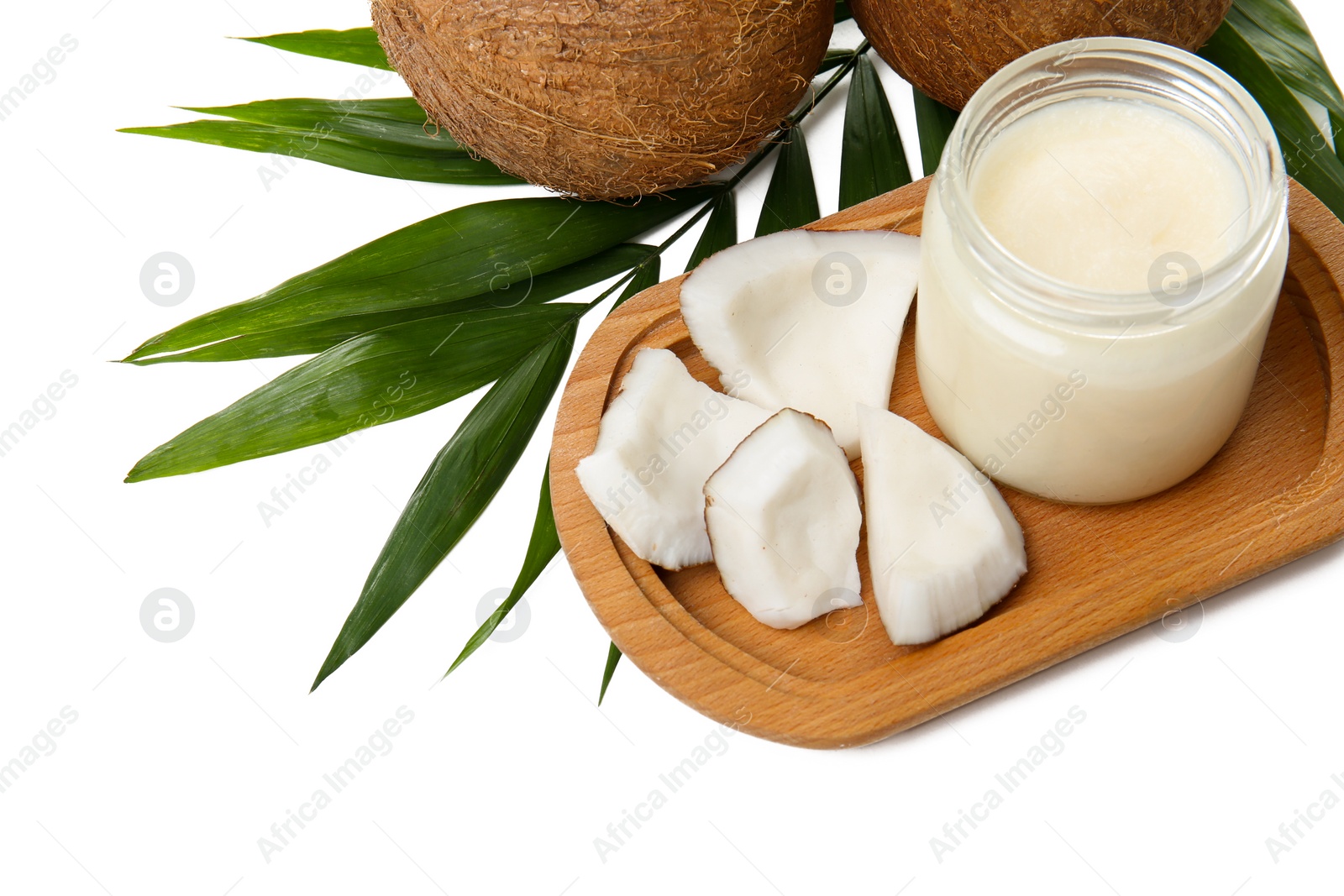 Jar with coconut oil and nuts on white background Photo of Jar with coconut oil and nuts on white background