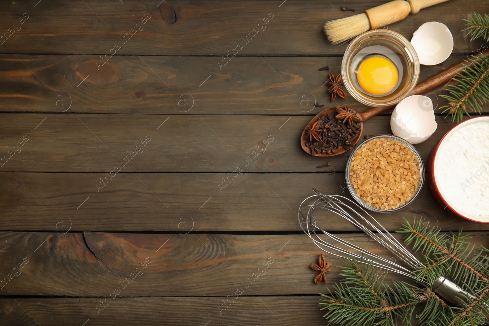 Flat lay composition with ingredients for traditional Christmas cake on wooden table. Space for text Photo of Flat lay composition with ingredients for traditional Christmas cake on wooden table. Space for text