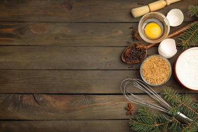 Flat lay composition with ingredients for traditional Christmas cake on wooden table. Space for text Photo of Flat lay composition with ingredients for traditional Christmas cake on wooden table. Space for text