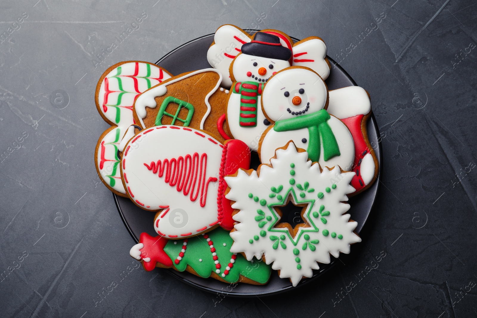 Delicious Christmas cookies on black table, top view Photo of Delicious Christmas cookies on black table, top view