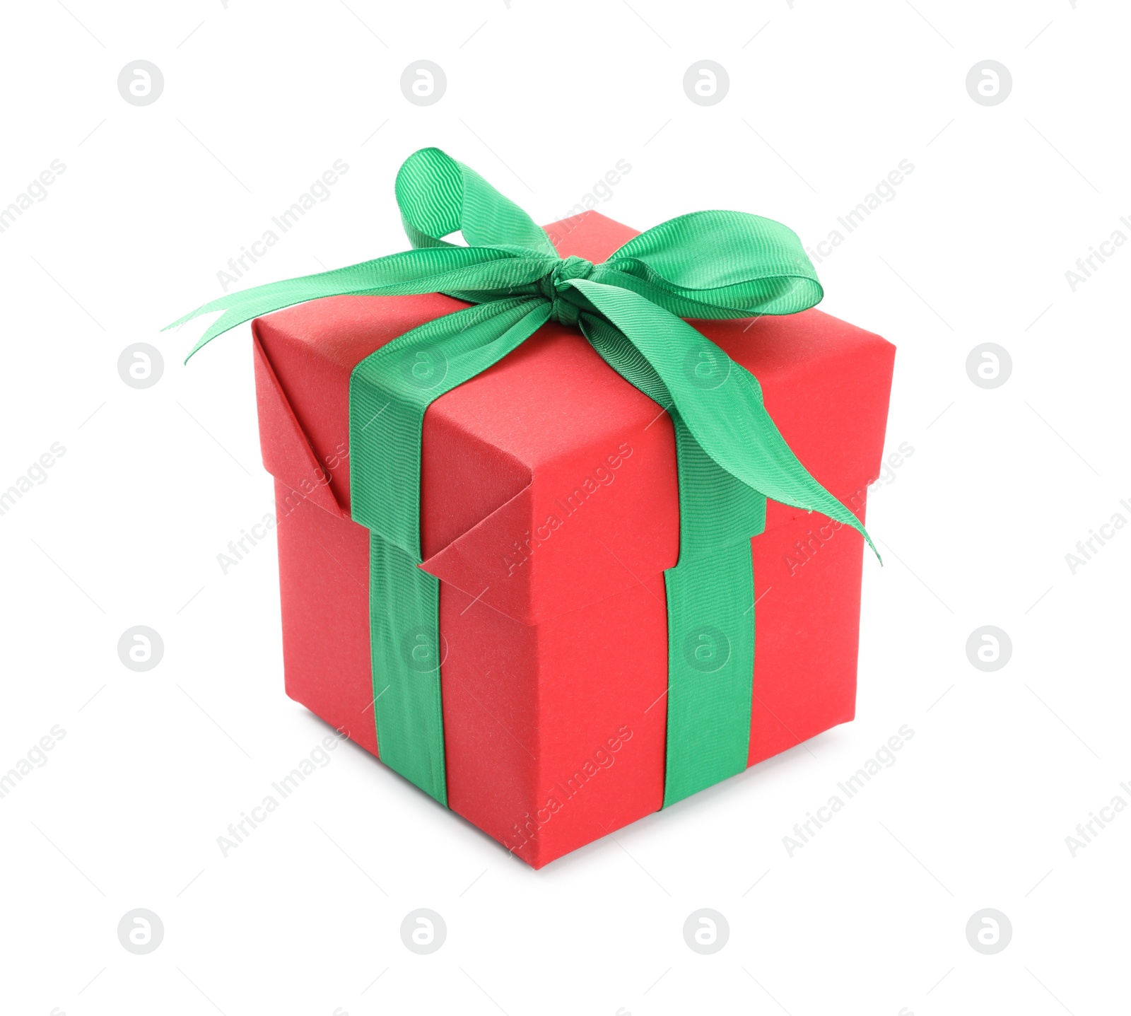Photo of Christmas gift box decorated with green bow isolated on white