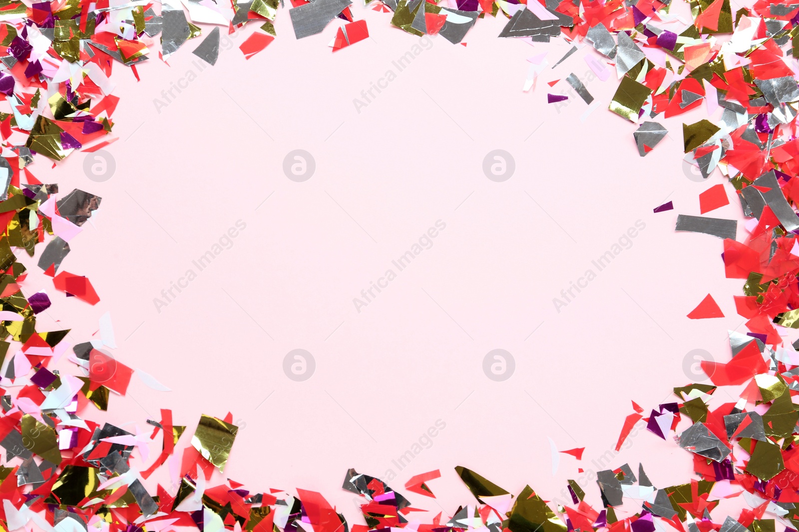 Frame of shiny colorful confetti on light background, flat lay. Space for text Photo of Frame of shiny colorful confetti on light background, flat lay. Space for text