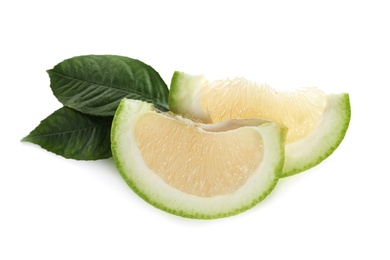 Slices of fresh ripe sweetie fruit and green leaves on white background Photo of Slices of fresh ripe sweetie fruit and green leaves on white background