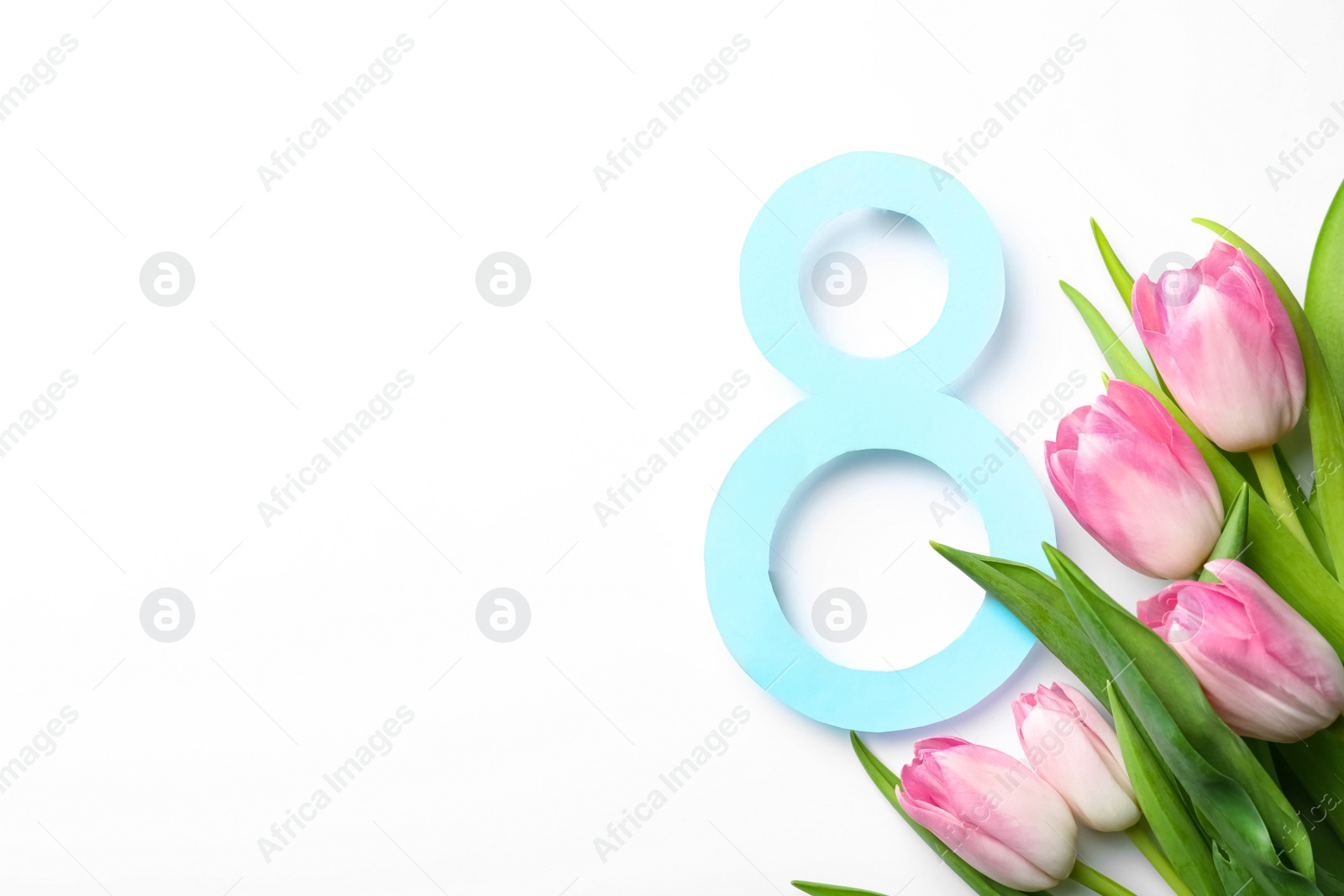 8 March greeting card design with tulips on white background, top view. Space for text Photo of 8 March greeting card design with tulips on white background, top view. Space for text